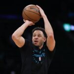 Charlotte Hornets guard Seth Curry (30) shoots during warm ups before a game against the Boston Celtics at TD Garden.