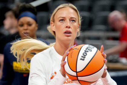 Indiana Fever guard Sophie Cunningham (8) warms up before a game Friday, Aug. 15, 2025, at Gainbridge Fieldhouse in Indianapolis.