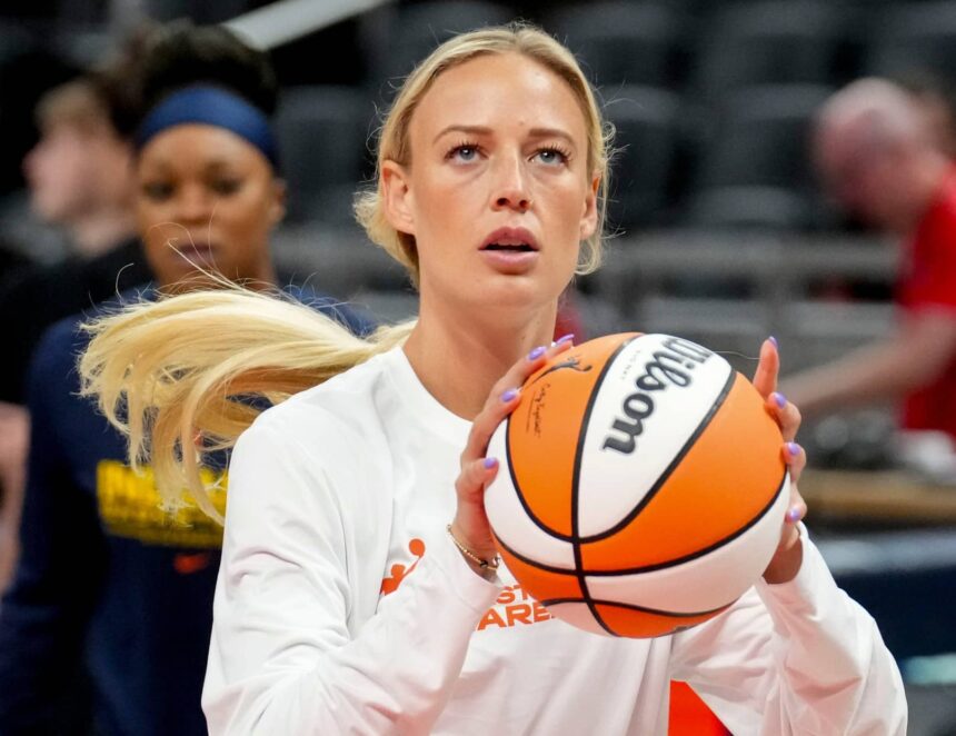 Indiana Fever guard Sophie Cunningham (8) warms up before a game Friday, Aug. 15, 2025, at Gainbridge Fieldhouse in Indianapolis.