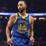 Golden State Warriors guard Stephen Curry (30) reacts after scoring against the Portland Trail Blazers in the first half at Moda Center.