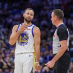 Golden State Warriors guard Stephen Curry (30) talks with referee Josh Tiven (58) during the second quarter against the Orlando Magic at Kia Center.