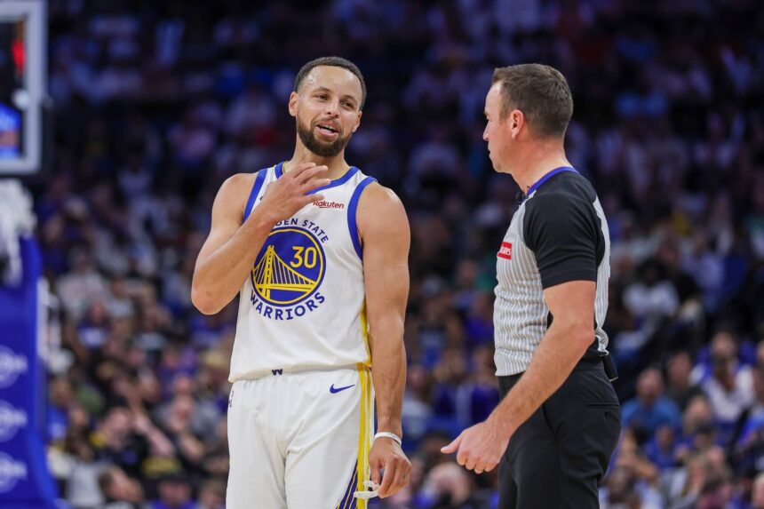 Golden State Warriors guard Stephen Curry (30) talks with referee Josh Tiven (58) during the second quarter against the Orlando Magic at Kia Center.