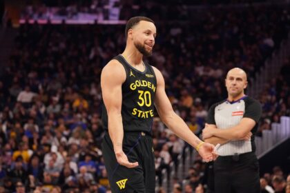 Golden State Warriors guard Stephen Curry (30) talks to the Houston Rockets bench during a break in the action in the third quarter at Chase Center.