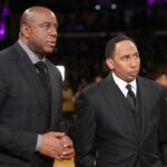 Mar 5, 2022; Los Angeles, California, USA; ESPN Analysts, Magic Johnson and Stephen A. Smith talk before the game between the Golden State Warriors and Los Angeles Lakers at Crypto.com Arena. The Lakers won 124-116. Mandatory Credit: Kiyoshi Mio-USA TODAY Sports