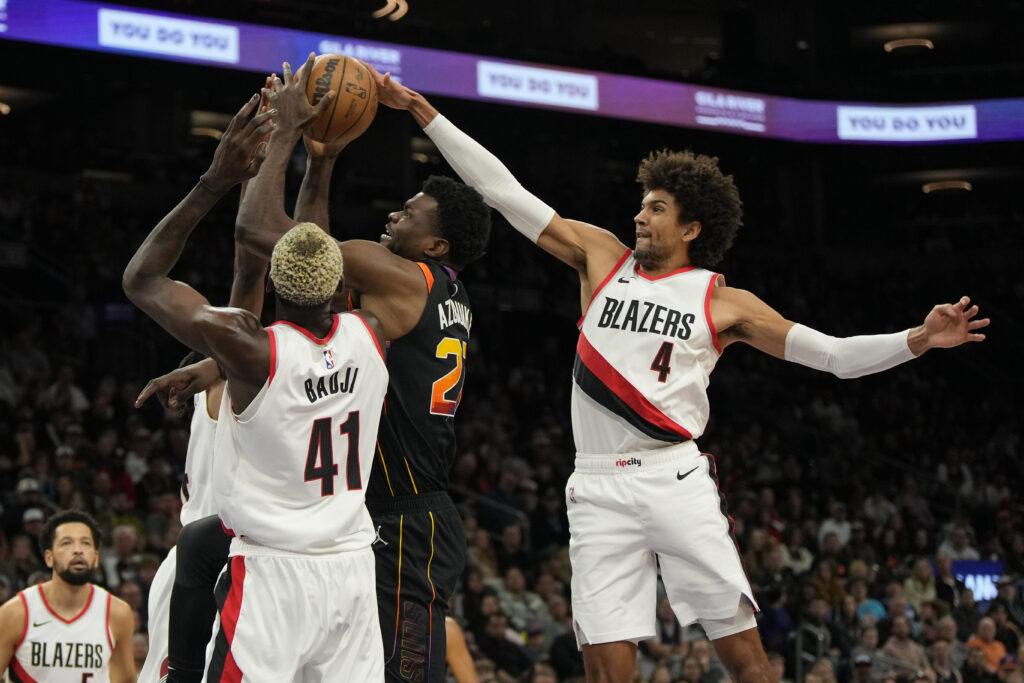 Jan 1, 2024; Phoenix, Arizona, USA; Portland Trail Blazers guard Matisse Thybulle (4) blocks the shot on Phoenix Suns center Udoka Azubuike (27) in the first half at Footprint Center. Mandatory Credit: Rick Scuteri-Imagn Images