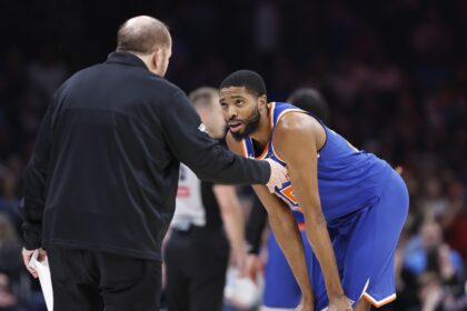 Jan 3, 2025; Oklahoma City, Oklahoma, USA; New York Knicks forward Mikal Bridges (25) talks with head coach Tom Thibodeau during a break in play against the Oklahoma City Thunder during the second quarter at Paycom Center. Mandatory Credit: Alonzo Adams-Imagn Images