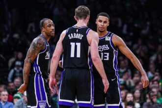 Jan 10, 2025; Boston, Massachusetts, USA; Sacramento Kings forward DeMar DeRozan (10), forward Keegan Murray (13) and forward Domantas Sabonis (11) react after defeating the Boston Celtics at TD Garden. Mandatory Credit: David Butler II-Imagn Images
