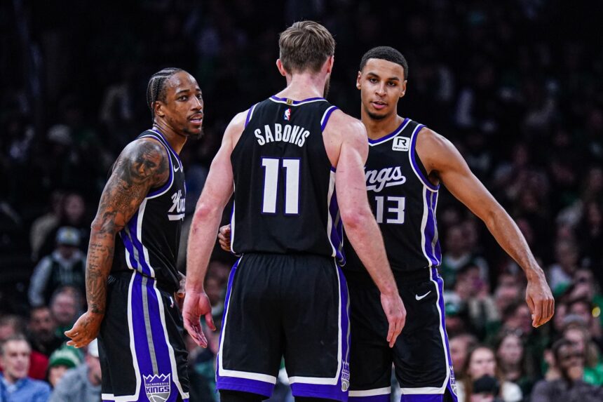 Jan 10, 2025; Boston, Massachusetts, USA; Sacramento Kings forward DeMar DeRozan (10), forward Keegan Murray (13) and forward Domantas Sabonis (11) react after defeating the Boston Celtics at TD Garden. Mandatory Credit: David Butler II-Imagn Images