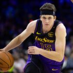 Jan 28, 2025; Philadelphia, Pennsylvania, USA; Los Angeles Lakers guard Austin Reaves (15) dribbles the ball against the Philadelphia 76ers during the second quarter at Wells Fargo Center. Mandatory Credit: Bill Streicher-Imagn Images