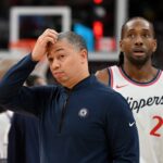 Feb 2, 2025; Toronto, Ontario, CAN; Los Angeles Clippers head coach Tyronn Lue scratches his head after calling a time out as forward Kawhi Leonard (2) walks past in the first half against the Toronto Raptors at Scotiabank Arena. Mandatory Credit: Dan Hamilton-Imagn Images