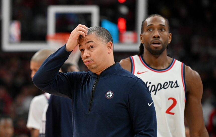 Feb 2, 2025; Toronto, Ontario, CAN; Los Angeles Clippers head coach Tyronn Lue scratches his head after calling a time out as forward Kawhi Leonard (2) walks past in the first half against the Toronto Raptors at Scotiabank Arena. Mandatory Credit: Dan Hamilton-Imagn Images