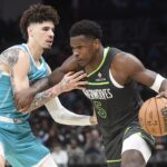 Mar 5, 2025; Charlotte, North Carolina, USA; Minnesota Timberwolves guard Anthony Edwards (5) drives past Charlotte Hornets guard LaMelo Ball (1) during the second half at the Spectrum Center. Mandatory Credit: Sam Sharpe-Imagn Images