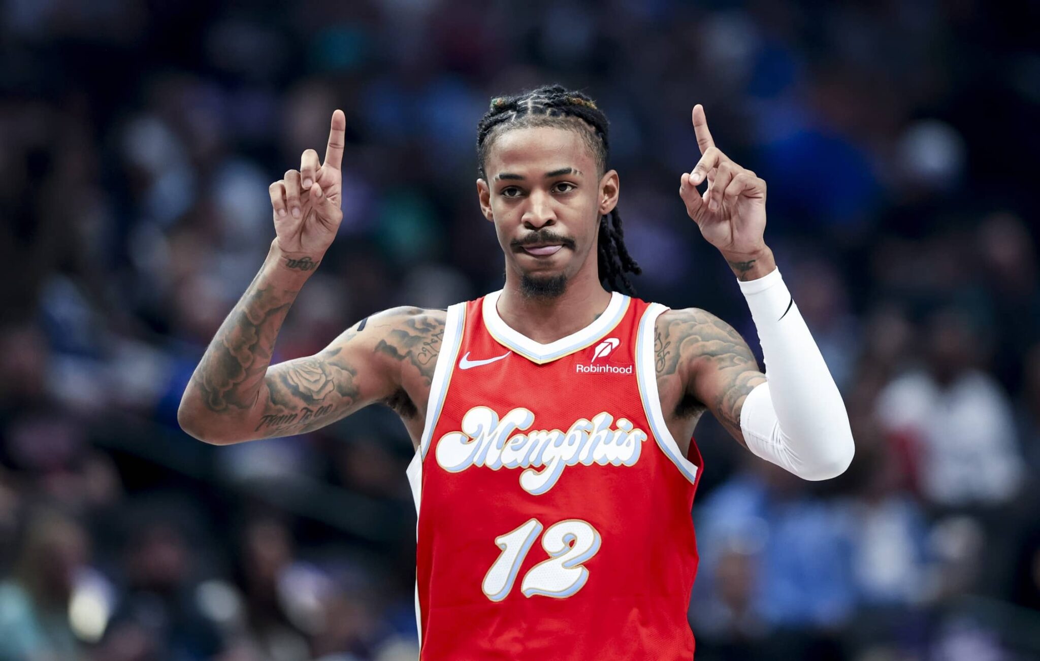 Mar 7, 2025; Dallas, Texas, USA; Memphis Grizzlies guard Ja Morant (12) reacts during the first quarter against the Dallas Mavericks at American Airlines Center. Mandatory Credit: Kevin Jairaj-Imagn Images
