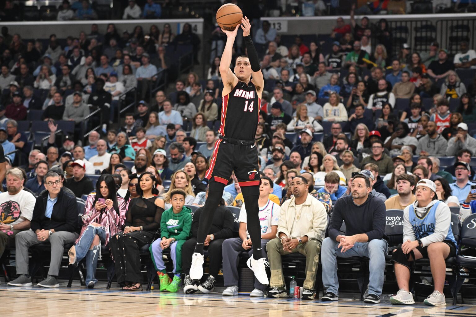 Mar 15, 2025; Memphis, Tennessee, USA; Miami Heat point guard Tyler Herro (14) shoots a wide open three-point shot in the first quarter of the game against the Memphis Grizzlies at FedExForum. Mandatory Credit: Matthew Smith-Imagn Images