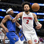 Mar 21, 2025; Dallas, Texas, USA; Dallas Mavericks guard Brandon Williams (10) knocks the ball away from Detroit Pistons guard Cade Cunningham (2) during the second half at the American Airlines Center. Mandatory Credit: Jerome Miron-Imagn Images