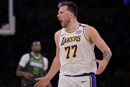 Apr 19, 2025; Los Angeles, California, USA; Los Angeles Lakers guard Luka Doncic (77) reacts after not getting a foul call in the second half against the Minnesota Timberwolves at Crypto.com Arena. Mandatory Credit: Jayne Kamin-Oncea-Imagn Images