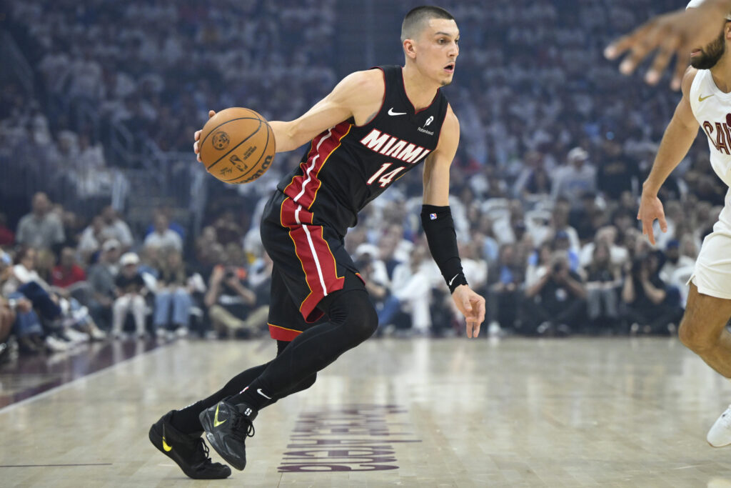 Apr 23, 2025; Cleveland, Ohio, USA; Miami Heat guard Tyler Herro (14) dribbles against the Cleveland Cavaliers in the first quarter of game two of the first round of the 2025 NBA Playoffs at Rocket Arena. Mandatory Credit: David Richard-Imagn Images