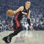 Cleveland, Ohio, USA; Miami Heat guard Tyler Herro (14) dribbles against the Cleveland Cavaliers in the first quarter of game two of the first round of the 2025 NBA Playoffs at Rocket Arena. Mandatory Credit: David Richard-Imagn Images