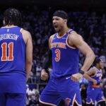 May 1, 2025; Detroit, Michigan, USA; New York Knicks guard Jalen Brunson (11) and guard Josh Hart (3) celebrate after defeating the Detroit Pistons during game six of first round for the 2024 NBA Playoffs at Little Caesars Arena. Mandatory Credit: Rick Osentoski-Imagn Images