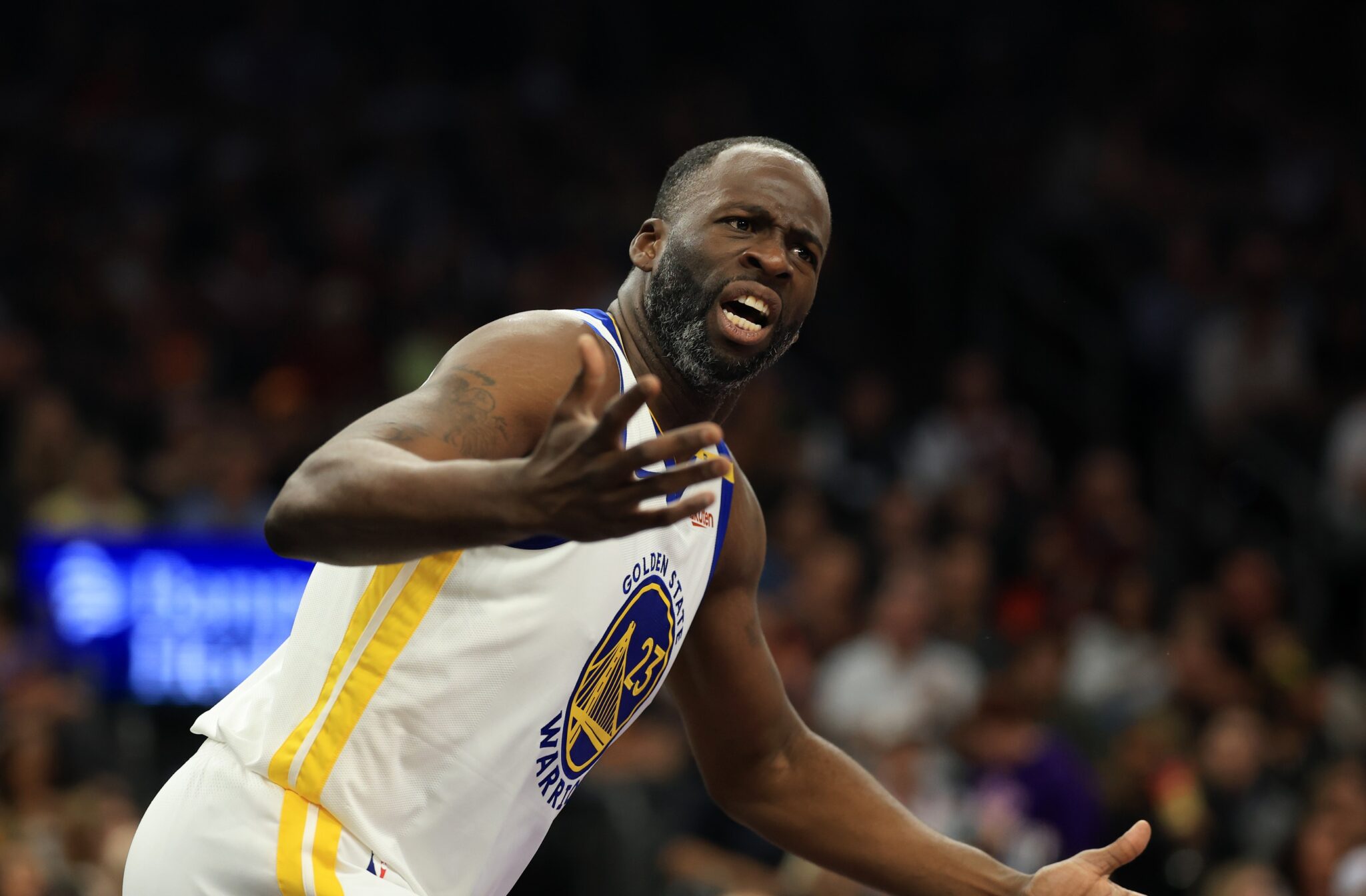 Apr 8, 2025; Phoenix, Arizona, USA; Golden State Warriors forward Draymond Green (23) reacts against the Phoenix Suns at Footprint Center. Mandatory Credit: Mark J. Rebilas-Imagn Images