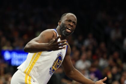 Apr 8, 2025; Phoenix, Arizona, USA; Golden State Warriors forward Draymond Green (23) reacts against the Phoenix Suns at Footprint Center. Mandatory Credit: Mark J. Rebilas-Imagn Images