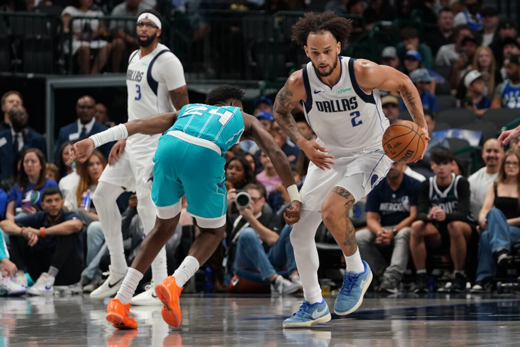 Oct 11, 2025; Dallas, Texas, USA; Dallas Mavericks center Dereck Lively II (2) makes a steal on Charlotte Hornets forward Brandon Miller (24) in the second half of a game at American Airlines Center. Mandatory Credit: Raymond Carlin III-Imagn Images