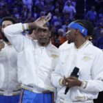 Oct 21, 2025; Oklahoma City, Oklahoma, USA; Oklahoma City Thunder guard Jalen Williams (8) gestures while Oklahoma City Thunder guard Shai Gilgeous-Alexander (2) looks at him during the NBA Championship ring ceremony at Paycom Center. Mandatory Credit: Alonzo Adams-Imagn Images