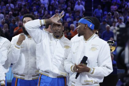 Oct 21, 2025; Oklahoma City, Oklahoma, USA; Oklahoma City Thunder guard Jalen Williams (8) gestures while Oklahoma City Thunder guard Shai Gilgeous-Alexander (2) looks at him during the NBA Championship ring ceremony at Paycom Center. Mandatory Credit: Alonzo Adams-Imagn Images
