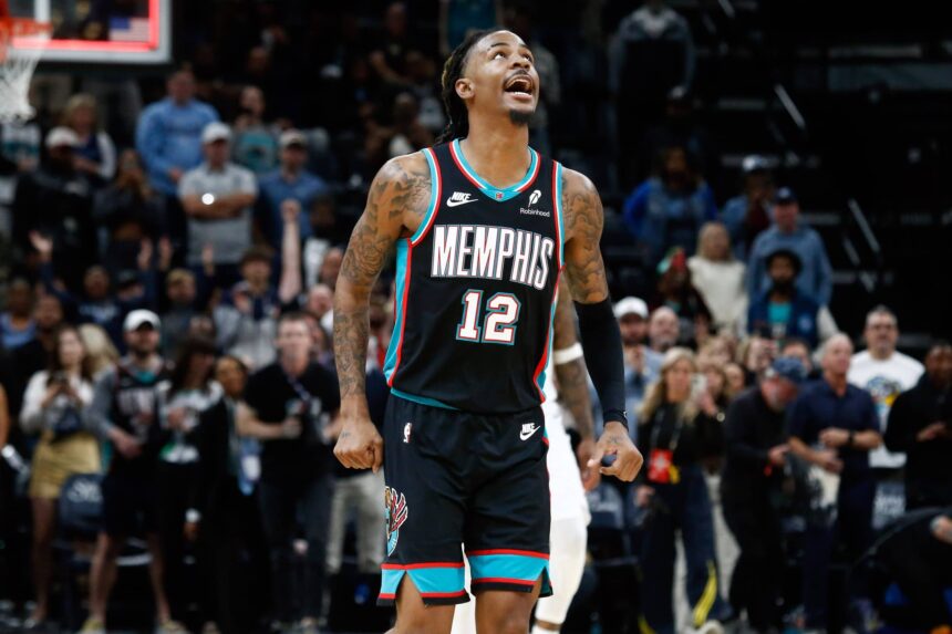 Oct 22, 2025; Memphis, Tennessee, USA; Memphis Grizzlies guard Ja Morant (12) reacts after defeating the New Orleans Pelicans at FedExForum. Mandatory Credit: Petre Thomas-Imagn Images