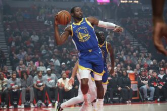 Oct 24, 2025; Portland, Oregon, USA; Golden State Warriors forward Jonathan Kuminga (1) passes the ball against the Portland Trail Blazers in the first half at Moda Center. Mandatory Credit: Jaime Valdez-Imagn Images