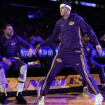 Oct 24, 2025; Los Angeles, California, USA; Los Angeles Lakers guard Luka Doncic (left) and guard Austin Reaves (15) interact before the game against the Minnesota Timberwolves at Crypto.com Arena. Mandatory Credit: Kirby Lee-Imagn Images