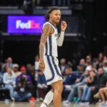 Oct 25, 2025; Memphis, Tennessee, USA; Memphis Grizzlies guard Ja Morant (12) looks on during the first half against the Indiana Pacers at FedExForum. Mandatory Credit: Wesley Hale-Imagn Images