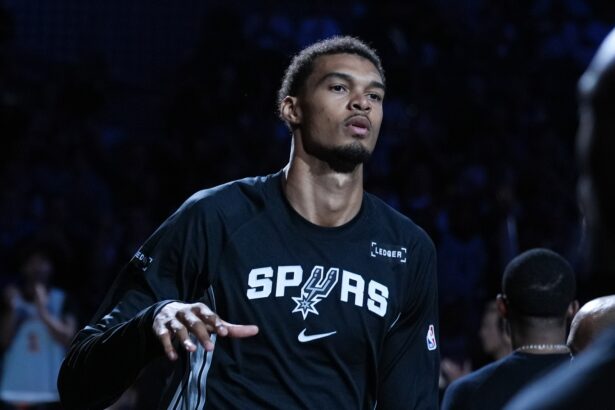 Oct 27, 2025; San Antonio, Texas, USA; San Antonio Spurs forward/center Victor Wembanyama (1) is introduced before the game against the Toronto Raptors at Frost Bank Center. Mandatory Credit: Daniel Dunn-Imagn Images