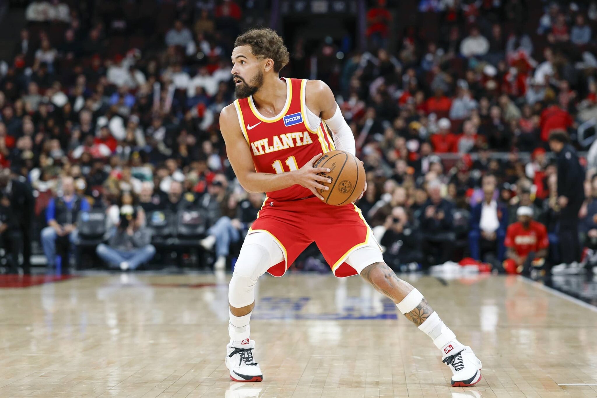 Oct 27, 2025; Chicago, Illinois, USA; Atlanta Hawks guard Trae Young (11) looks to pass the ball against the Chicago Bulls during the second half at United Center. Mandatory Credit: Kamil Krzaczynski-Imagn Images