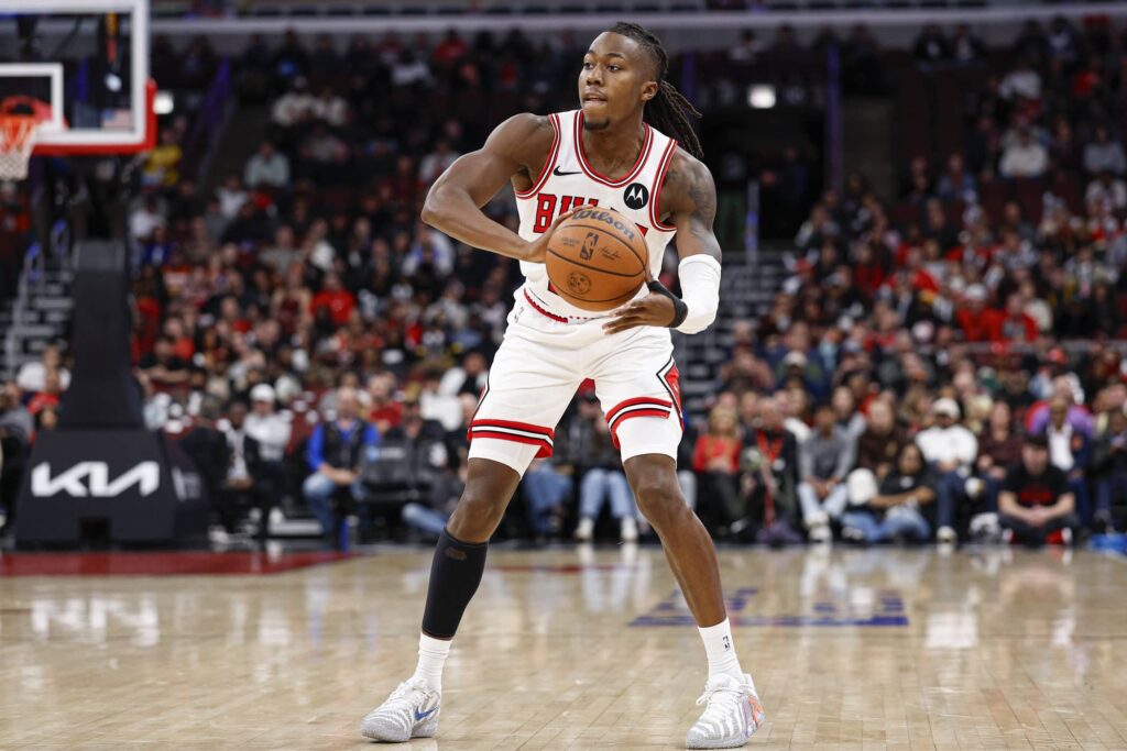 Oct 27, 2025; Chicago, Illinois, USA; Chicago Bulls guard Ayo Dosunmu (11) looks to pass the ball against the Atlanta Hawks during the first half at United Center. Mandatory Credit: Kamil Krzaczynski-Imagn Images