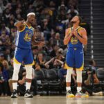 Oct 27, 2025; San Francisco, California, USA; Golden State Warriors forward Jimmy Butler III (10) talks with guard Stephen Curry (30) during a break in the action against the Memphis Grizzlies in the third quarter at the Chase Center. Mandatory Credit: Cary Edmondson-Imagn Images