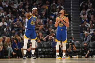 Oct 27, 2025; San Francisco, California, USA; Golden State Warriors forward Jimmy Butler III (10) talks with guard Stephen Curry (30) during a break in the action against the Memphis Grizzlies in the third quarter at the Chase Center. Mandatory Credit: Cary Edmondson-Imagn Images