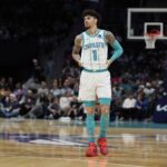 Oct 30, 2025; Charlotte, North Carolina, USA; Charlotte Hornets guard LaMelo Ball (1) during a free throw during the first quarter against the Orlando Magic at Spectrum Center. Mandatory Credit: Jim Dedmon-Imagn Images