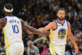 Oct 30, 2025; Milwaukee, Wisconsin, USA; Golden State Warriors guard Stephen Curry (30) reacts with forward Jimmy Butler (10) after scoring a basket in the 3rd quarter against the Milwaukee Bucks at Fiserv Forum. Mandatory Credit: Benny Sieu-Imagn Images