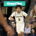 Oct 30, 2025; San Antonio, Texas, USA; San Antonio Spurs guard Dylan Harper (2) gets back on defense during the first half against the Miami Heat at Frost Bank Center. Mandatory Credit: Scott Wachter-Imagn Images