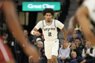 Oct 30, 2025; San Antonio, Texas, USA; San Antonio Spurs guard Dylan Harper (2) gets back on defense during the first half against the Miami Heat at Frost Bank Center. Mandatory Credit: Scott Wachter-Imagn Images