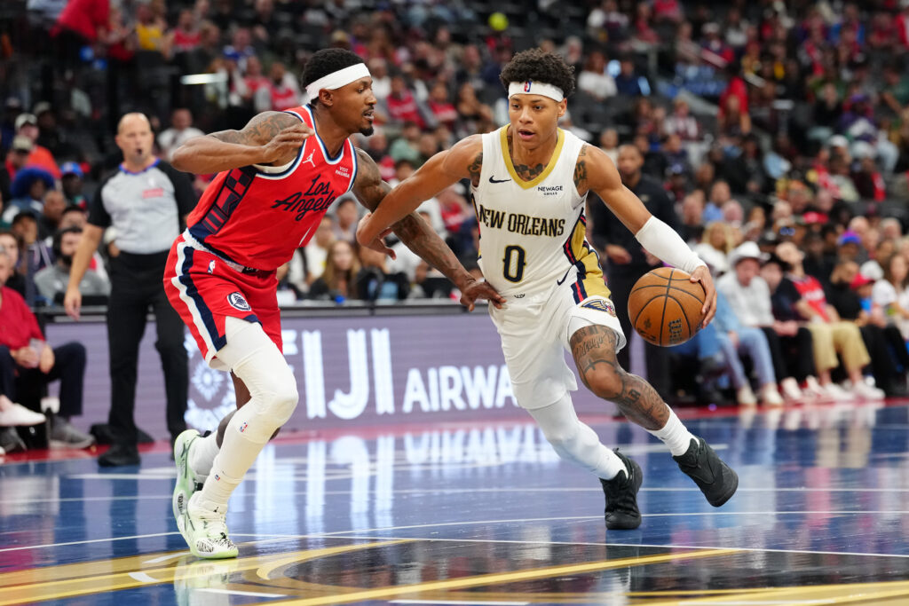 Oct 31, 2025; Inglewood, California, USA; New Orleans Pelicans guard Jeremiah Fears (0) dribbles the ball against LA Clippers guard Bradley Beal (0) in the first half at Intuit Dome. Mandatory Credit: Kirby Lee-Imagn Images