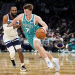 Nov 1, 2025; Charlotte, North Carolina, USA; Charlotte Hornets guard Kon Knueppel (7) handles the ball against Minnesota Timberwolves guard Mike Conley (10) during the second quarter at Spectrum Center. Mandatory Credit: Jim Dedmon-Imagn Images
