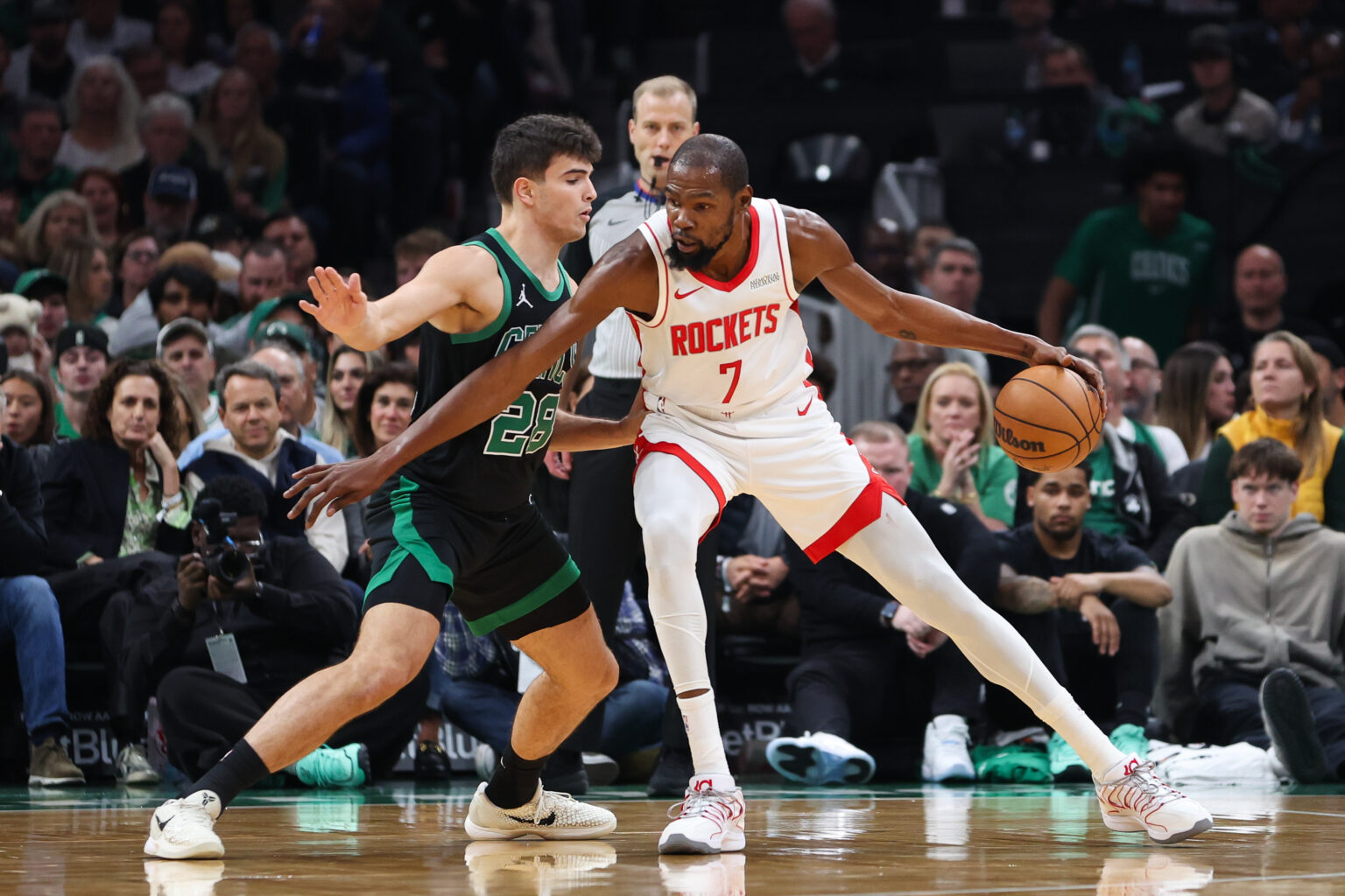 Nov 1, 2025; Boston, Massachusetts, USA; Boston Celtics forward Hugo Gonzalez (28) defends Houston Rockets forward Kevin Durant (7) during the first half at TD Garden. Mandatory Credit: Paul Rutherford-Imagn Images