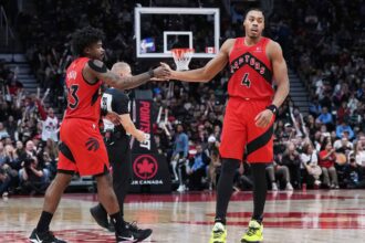 Nov 2, 2025; Toronto, Ontario, CAN; Toronto Raptors forward Scottie Barnes (4) celebrates a play with guard Jamal Shead (23) against the Memphis Grizzlies during the fourth quarter at Scotiabank Arena. Mandatory Credit: Nick Turchiaro-Imagn Images