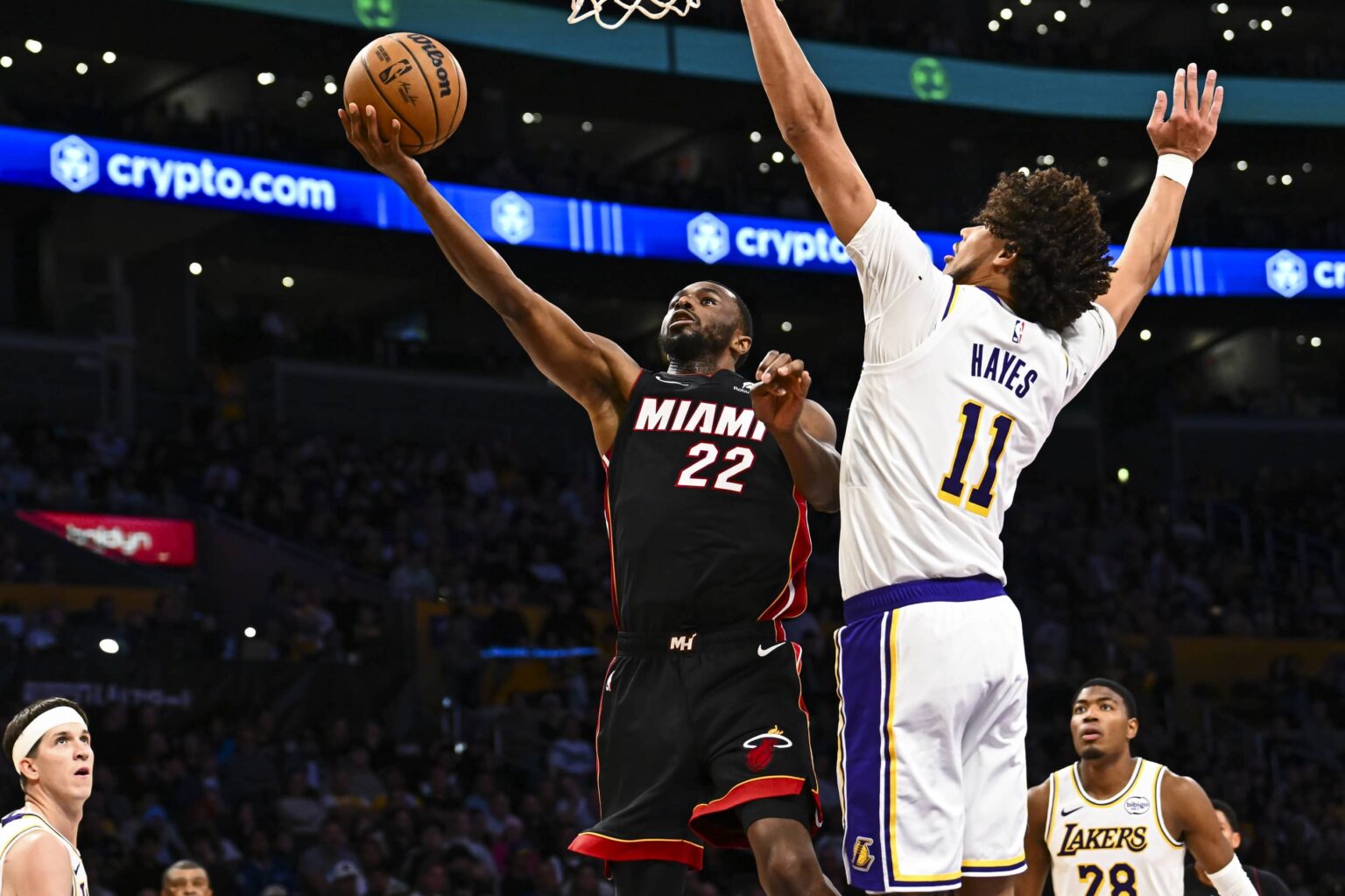 Nov 2, 2025; Los Angeles, California, USA; Miami Heat forward Andrew Wiggins (22) shoots a layup against Los Angeles Lakers center Jaxson Hayes (11) during the first half at Crypto.com Arena. Mandatory Credit: Jonathan Hui-Imagn Images