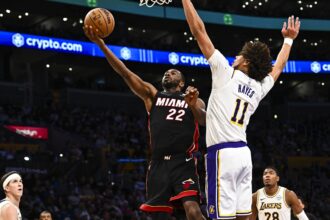 Nov 2, 2025; Los Angeles, California, USA; Miami Heat forward Andrew Wiggins (22) shoots a layup against Los Angeles Lakers center Jaxson Hayes (11) during the first half at Crypto.com Arena. Mandatory Credit: Jonathan Hui-Imagn Images