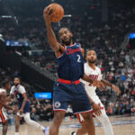 Nov 3, 2025; Inglewood, California, USA; LA Clippers forward Kawhi Leonard (2) reaches for the ball against Miami Heat guard Norman Powell (24) in the first half at Intuit Dome. Mandatory Credit: Kirby Lee-Imagn Images