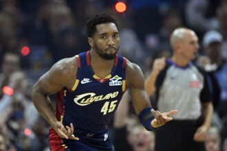 Nov 5, 2025; Cleveland, Ohio, USA; Cleveland Cavaliers guard Donovan Mitchell (45) celebrates his three-point basket in the first quarter against the Philadelphia 76ers at Rocket Arena. Mandatory Credit: David Richard-Imagn Images