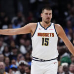 Nov 5, 2025; Denver, Colorado, USA; Denver Nuggets center Nikola Jokic (15) during the first quarter against the Miami Heat at Ball Arena. Mandatory Credit: Ron Chenoy-Imagn Images